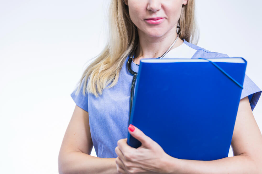 close up female dentist with folder 1